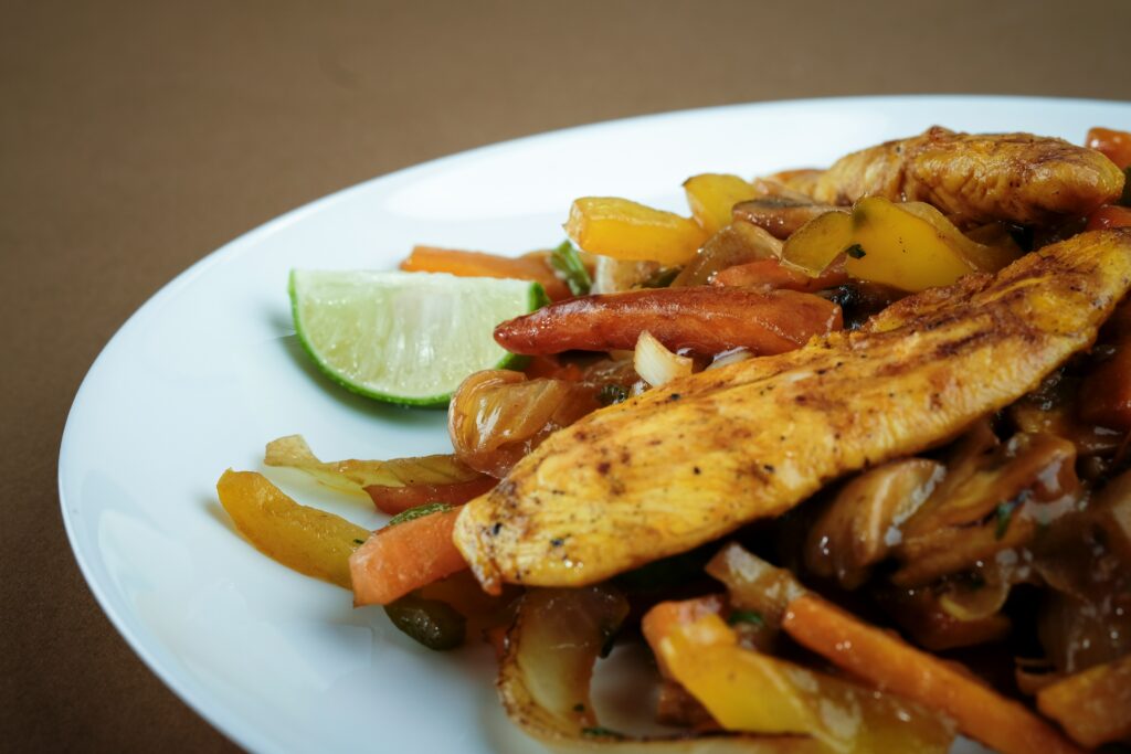finished quick chicken stir fry served with rice in bowl